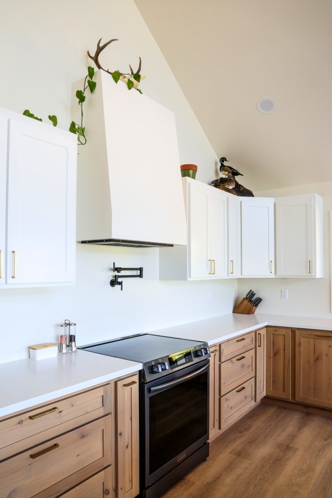 Cabinets beside range and range hood built by hostetler custom cabinetry