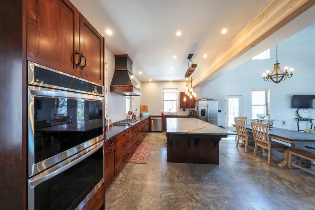 Full kitchen set with island and cabinets designed and built by Hostetler Custom Cabinets