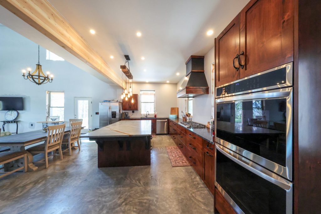 Full kitchen set with island and cabinets designed and built by Hostetler Custom Cabinets